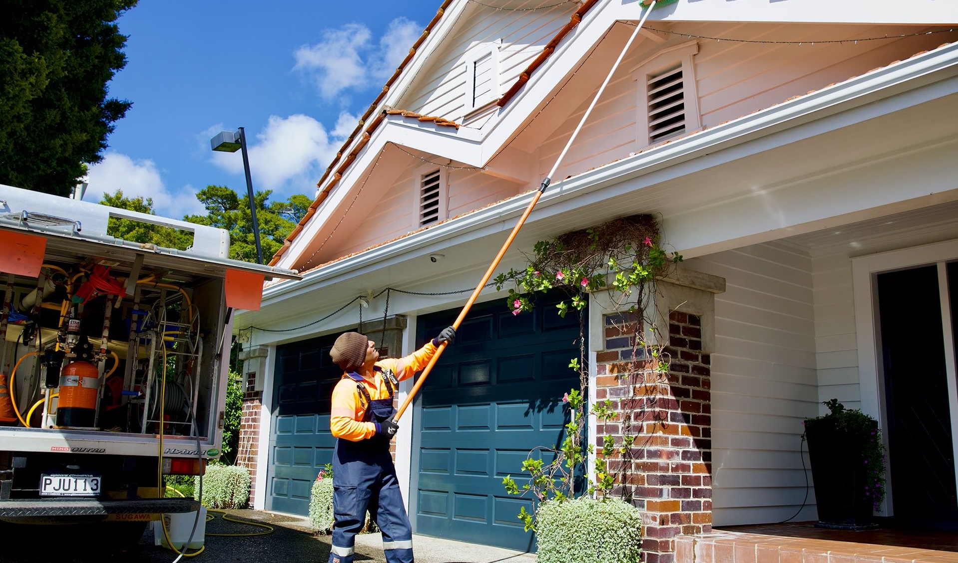 Professional house wash equipment and pressure washers in action